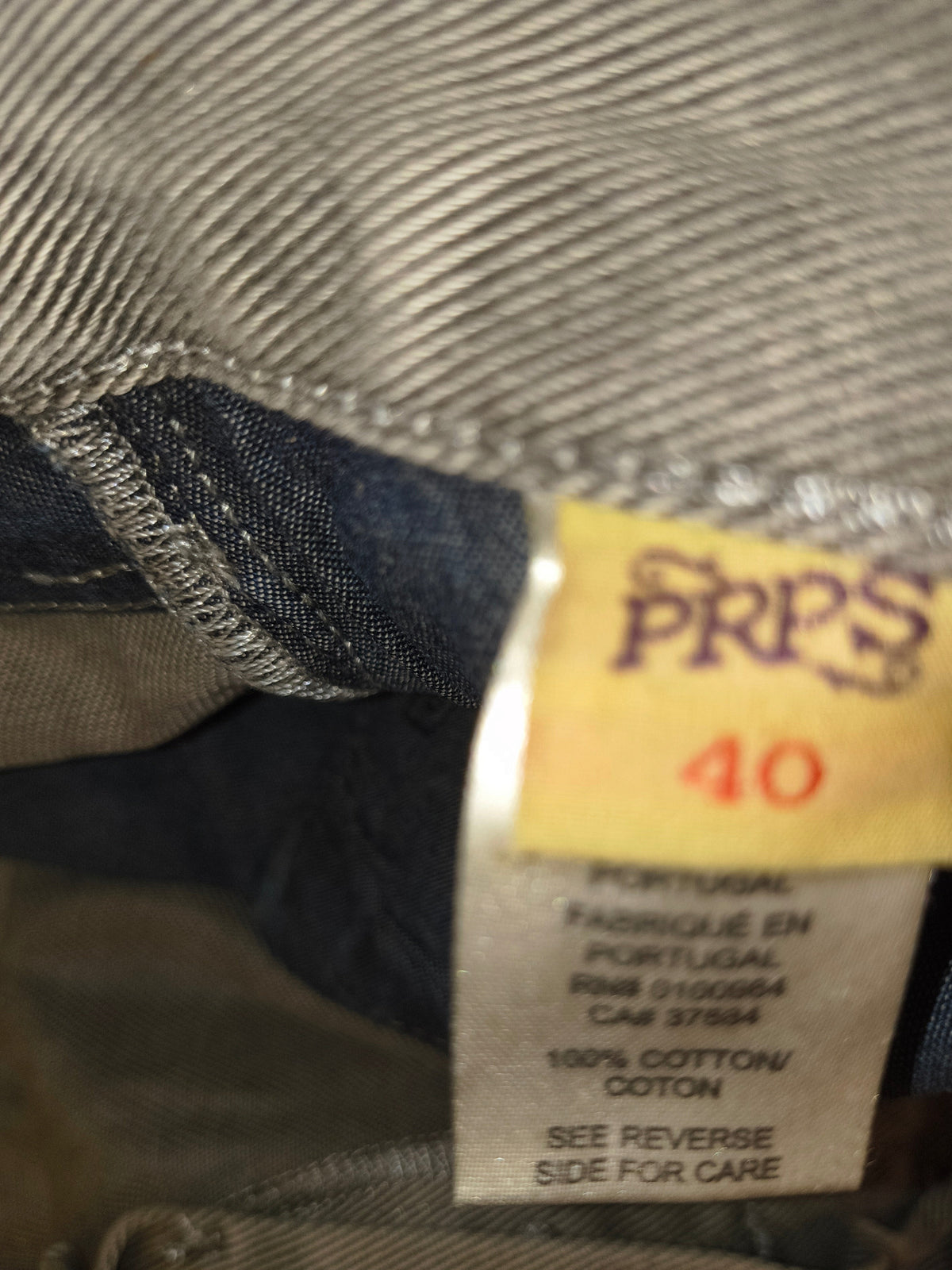 Awsum Thrift PRPS gray jeans size 40 tag showing 100 percent cotton material and made in Portugal label