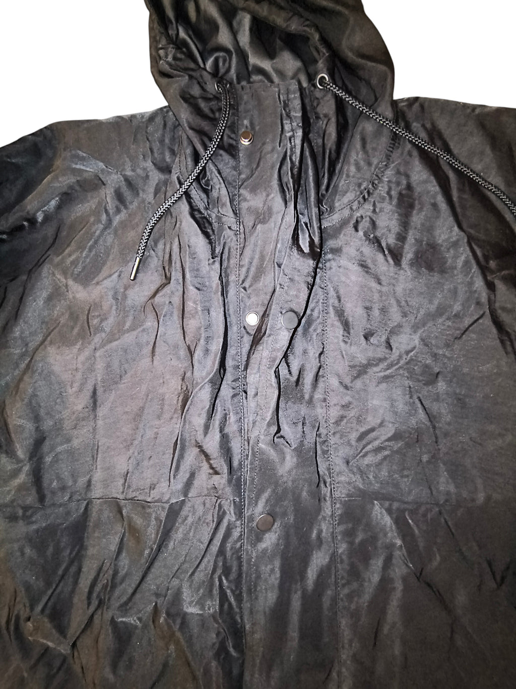 Awsum Thrift Publish Brand matte black longline hooded parka jacket with full-zip front and button storm flap.