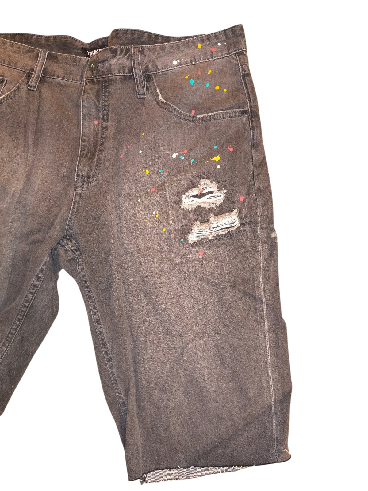 Awsum Thrift Truck Fit shorts in charcoal denim with distressed rips and colorful paint splatter details