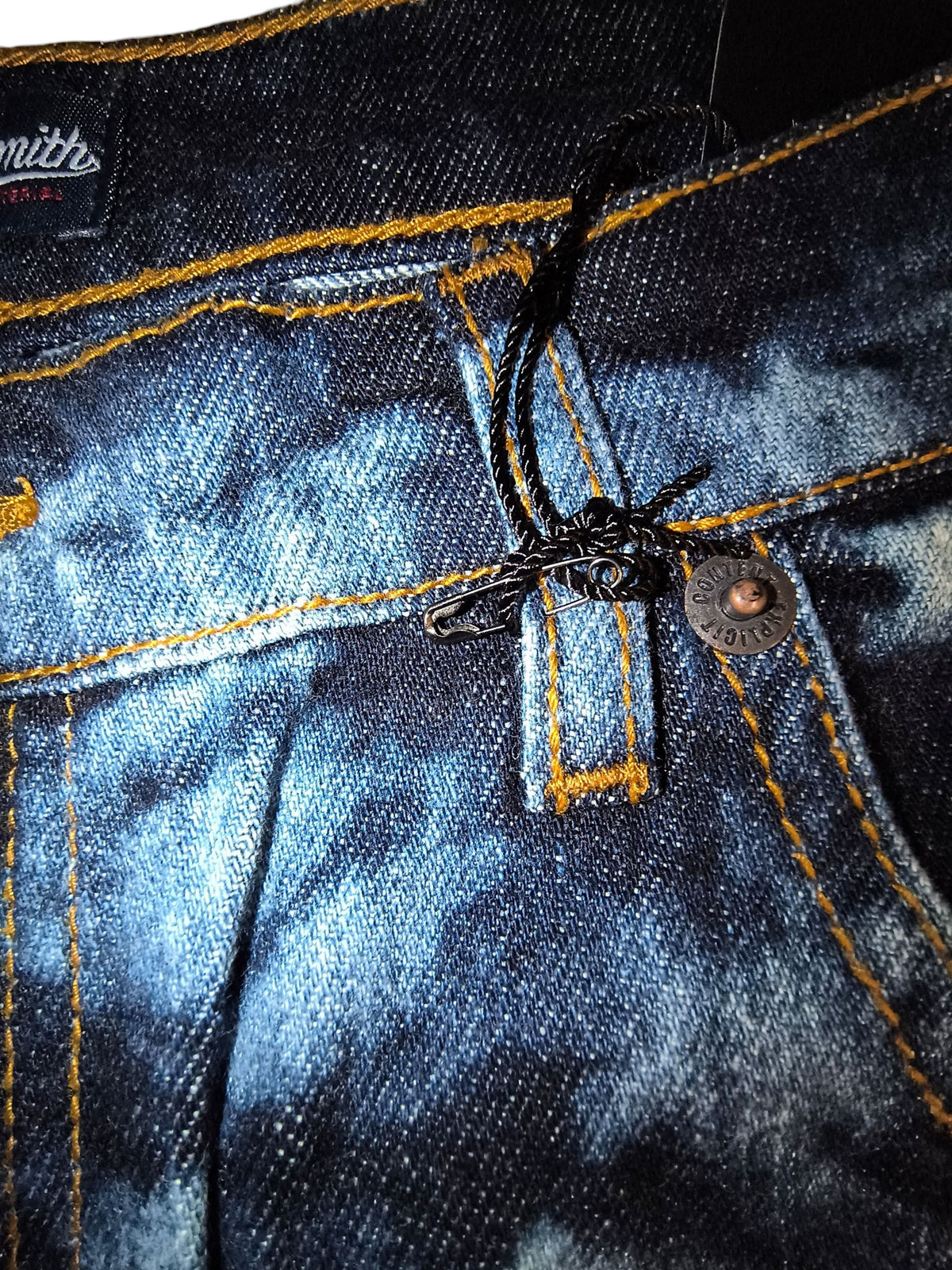 Awsum Thrift Rocksmith NYC tie-dye bleached indigo jeans with contrast stitching and safety-pin logo detail