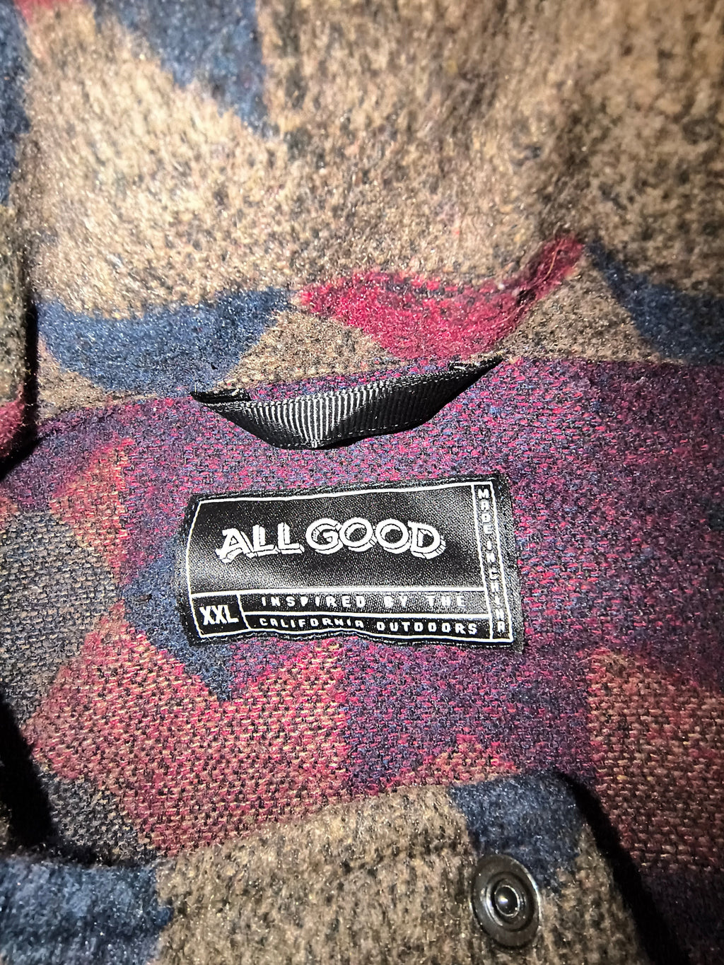 Awsum Thrift All Good brand clothing label showing size XXL and Inspired by the California Outdoors text