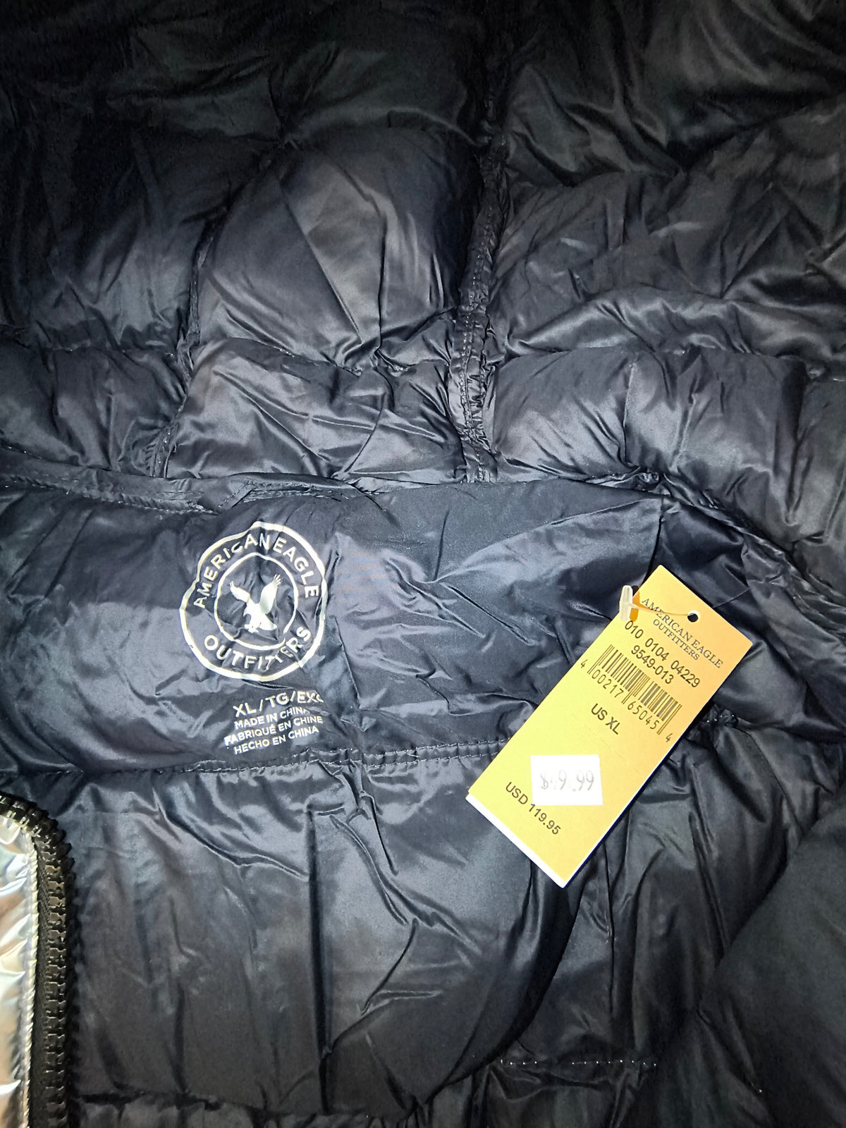 Awsum Thrift American Eagle Outfitters retail price tag for a men's XL puffer jacket with original pricing