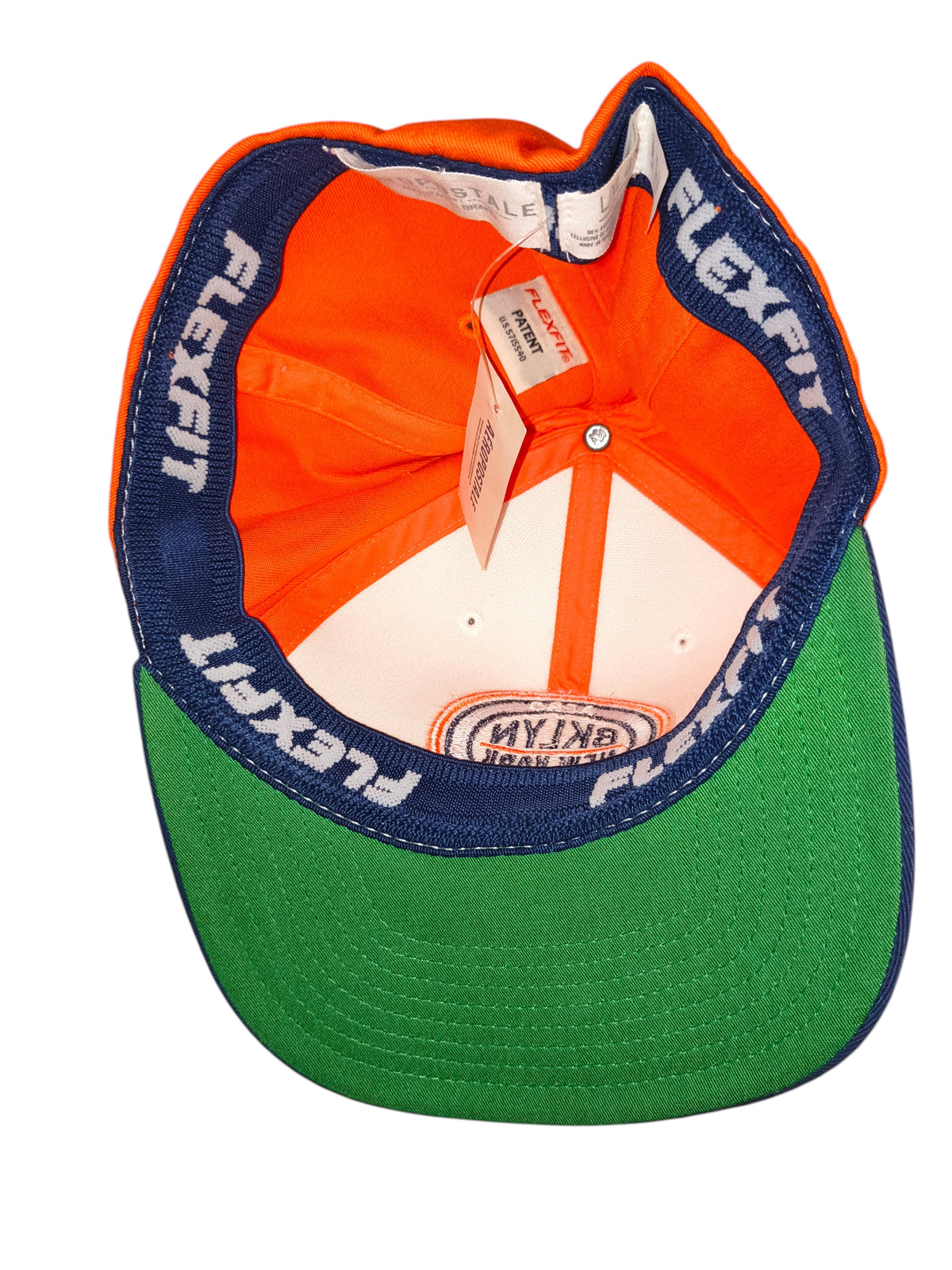 Awsum Thrift Aéropostale Flexfit hat interior showing orange crown, green under-brim, and branded stretch-band lining.