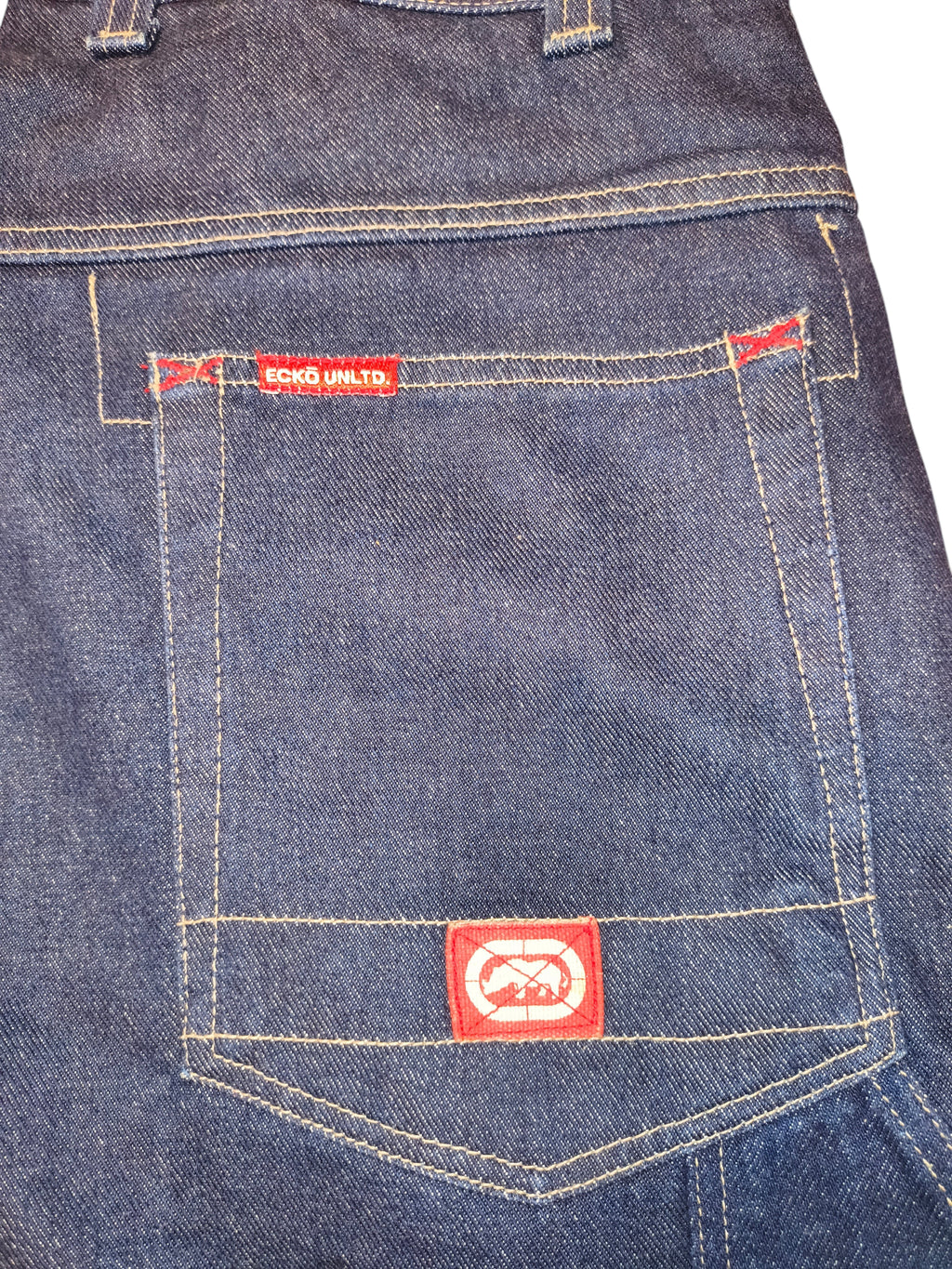 Awsum Thrift Ecko Unltd dark blue denim shorts with red logo patches and contrast stitching on the back pocket