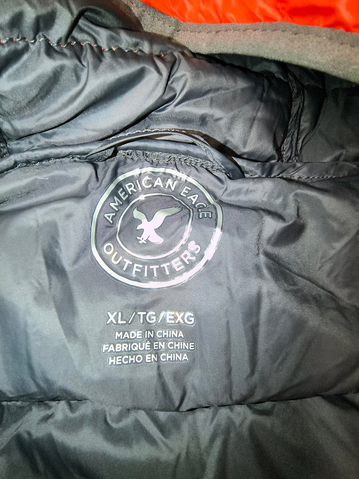 Awsum Thrift American Eagle Outfitters puffer jacket interior logo patch and size label in white nylon fabric