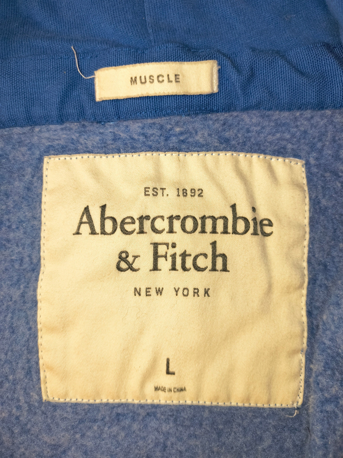 Awsum Thrift Abercrombie & Fitch vintage muscle fit hoodie interior brand and size label on heather blue fleece