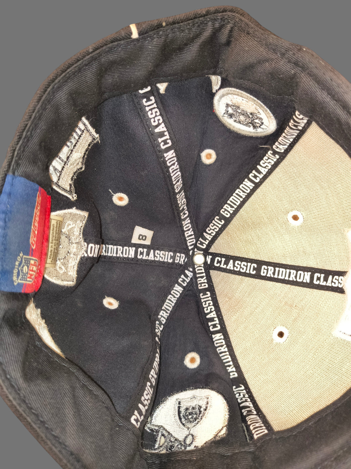 Interior view of Awsum Thrift vintage Reebok NFL Gridiron Classics wool fitted hat showing size 8 label and branding