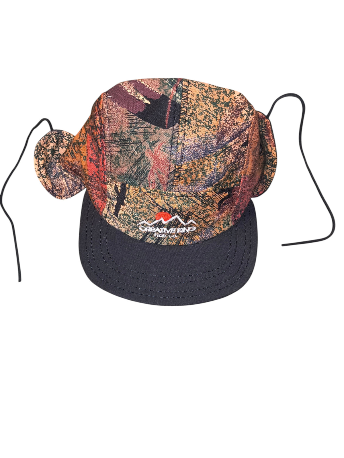 Awsum Thrift Creative King Hat Co. 5-panel snapback with ear flaps, featuring earth-toned camo tapestry and mountain logo