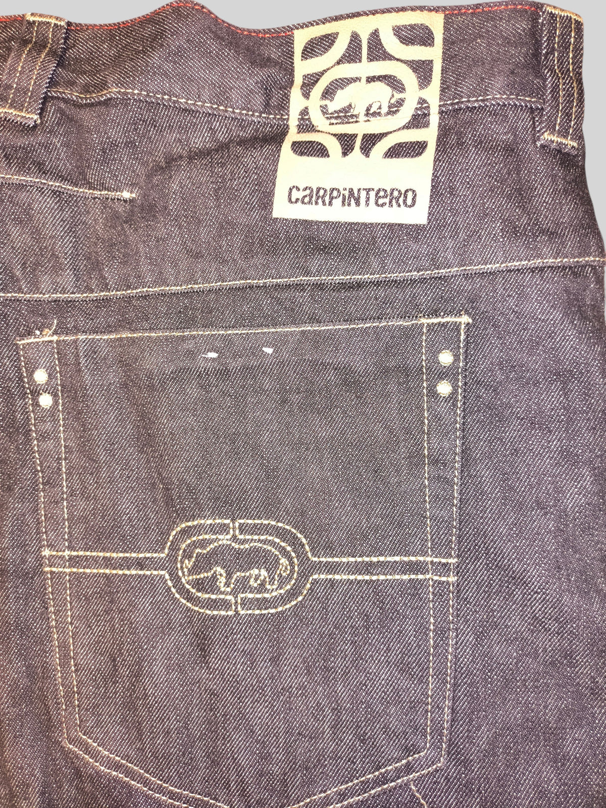 Awsum Thrift Ecko Carpintero dark denim carpenter jeans with embroidered rhino logo on the back pocket