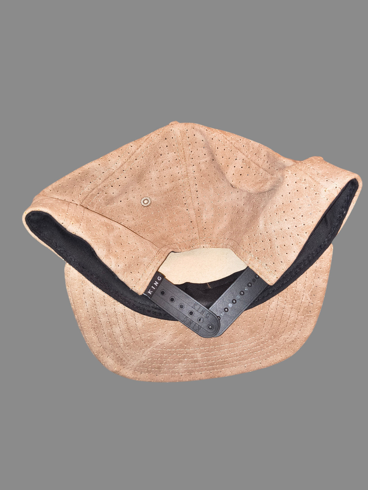 Awsum Thrift King Apparel tan perforated faux-leather snapback hat with black adjustable closure and interior lining