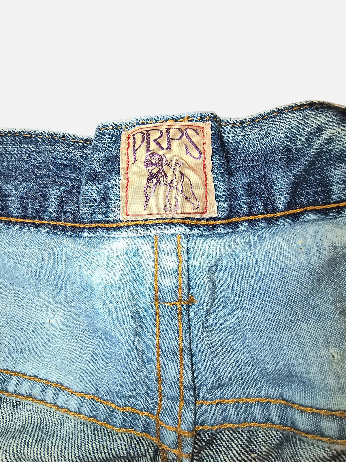 Awsum Thrift PRPS denim shorts featuring a light blue wash, orange contrast stitching, and a branded back waist label.