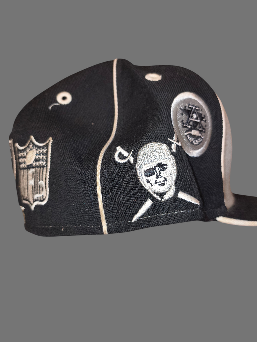 Awsum Thrift vintage Reebok Raiders wool fitted hat with embroidered team logos and NFL shield on black panels