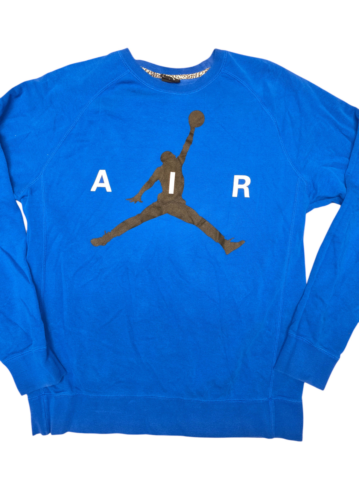 Awsum Thrift blue Jordan crewneck sweatshirt featuring a black Jumpman logo and white AIR lettering on the chest.