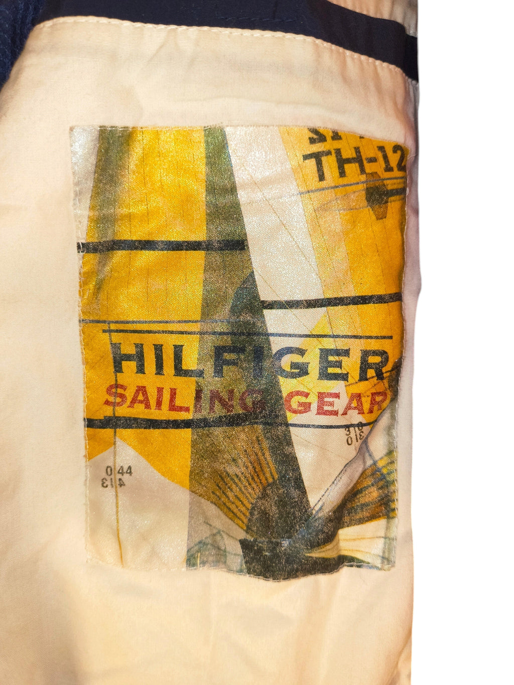 Awsum Thrift vintage Tommy Hilfiger sailing gear jacket patch detail with yellow and blue graphic design