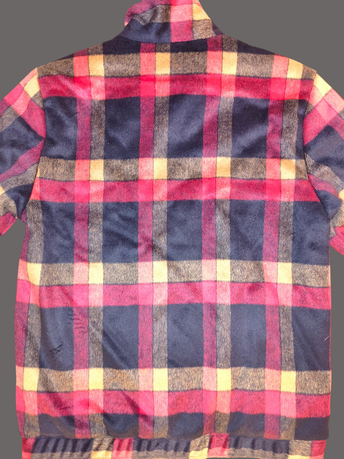 Back view of the Awsum Thrift The One Hundred Jacket featuring a red, navy, and yellow plaid fleece pattern.