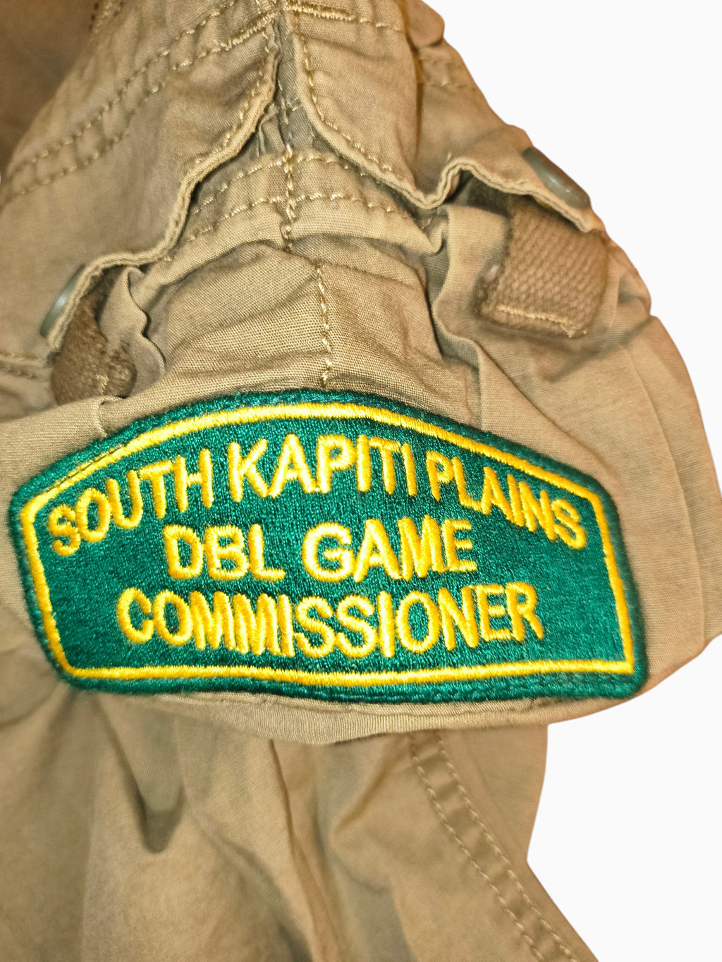Awsum Thrift Decibel khaki cotton canvas tactical cargo pants featuring a green and gold South Kapiti Plains patch