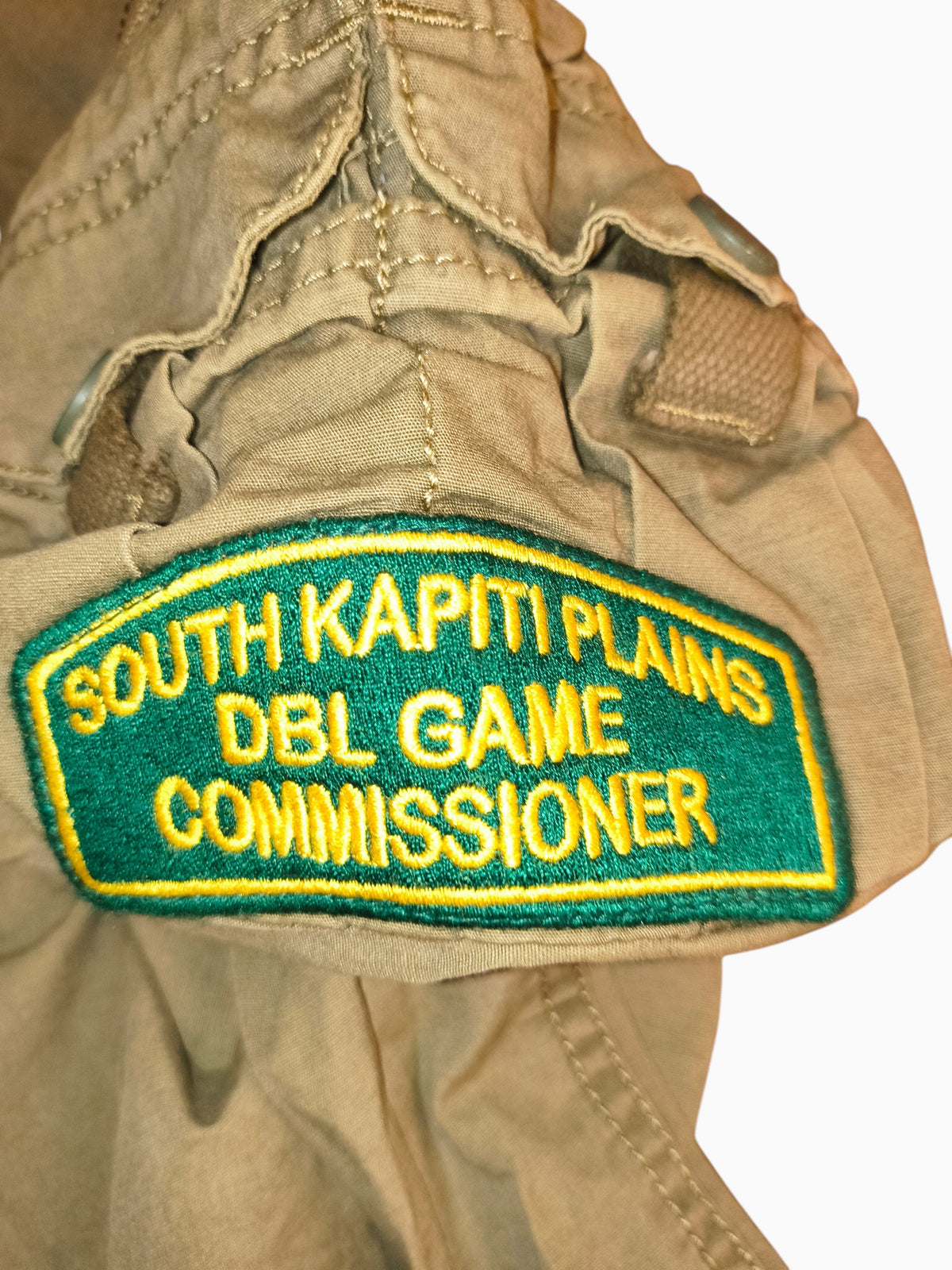 Awsum Thrift Decibel khaki cotton canvas tactical cargo pants featuring a green and gold South Kapiti Plains patch