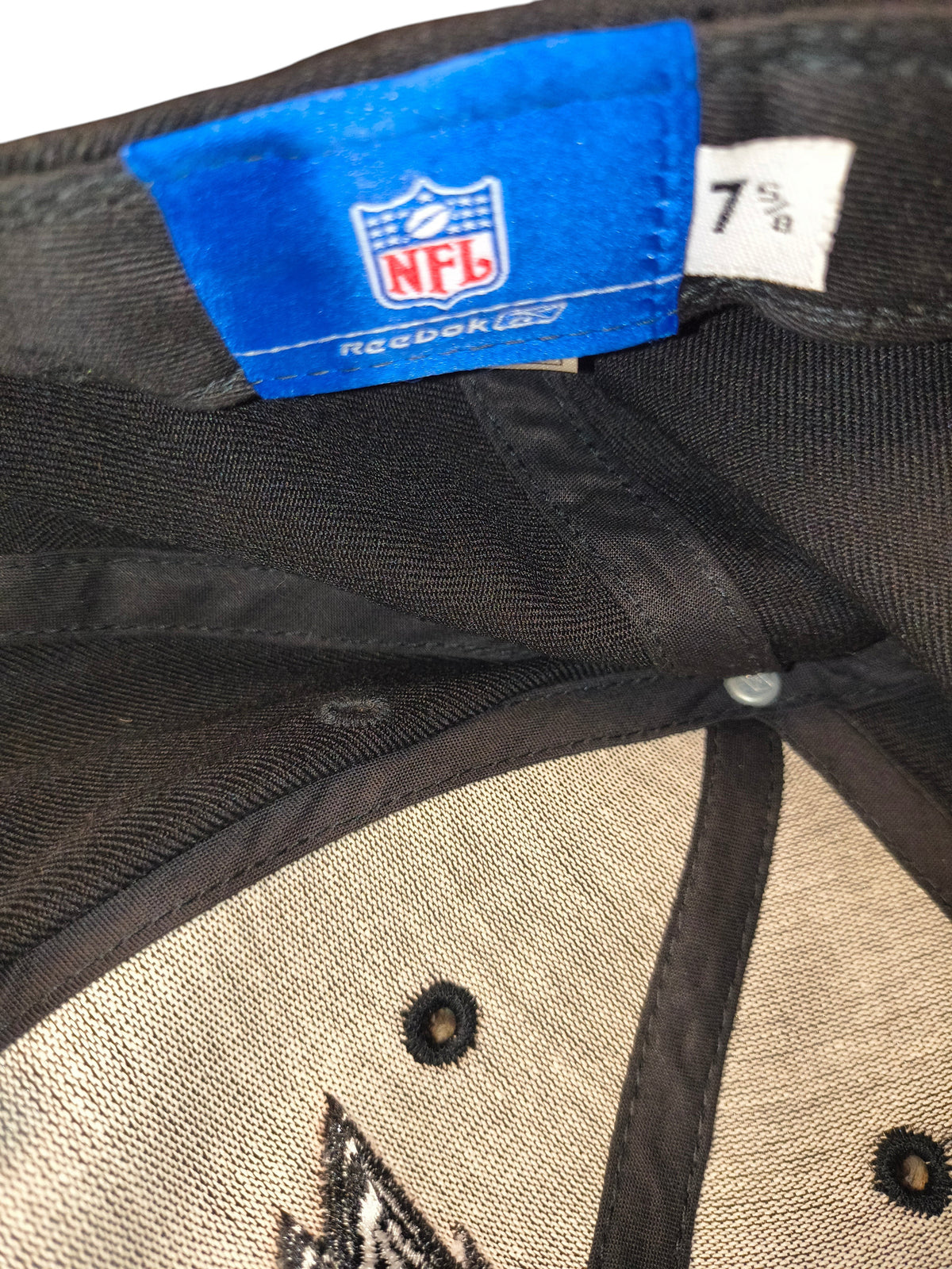 Awsum Thrift vintage Reebok Philadelphia Eagles fitted hat interior tag showing NFL branding and size 7 5/8