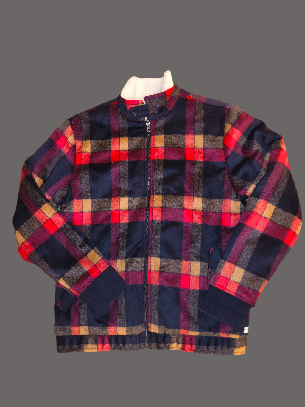Awsum Thrift The One Hundred Jacket in a red, navy, and tan plaid pattern with a warm white sherpa-lined collar.