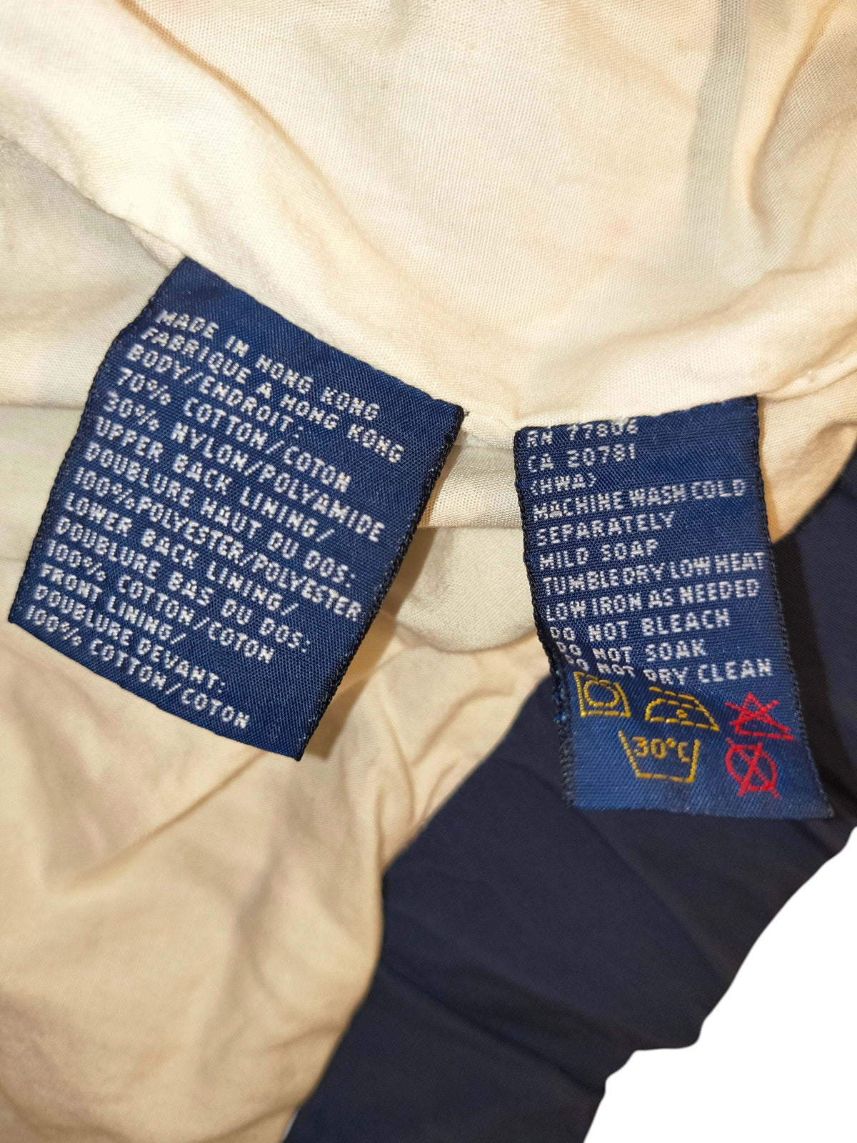 Awsum Thrift vintage Tommy Hilfiger jacket care and material label showing cotton and nylon blend composition