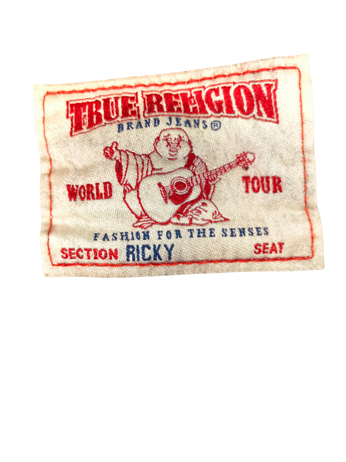 Awsum Thrift True Religion jeans clothing label with red embroidered Buddha logo and Ricky section text