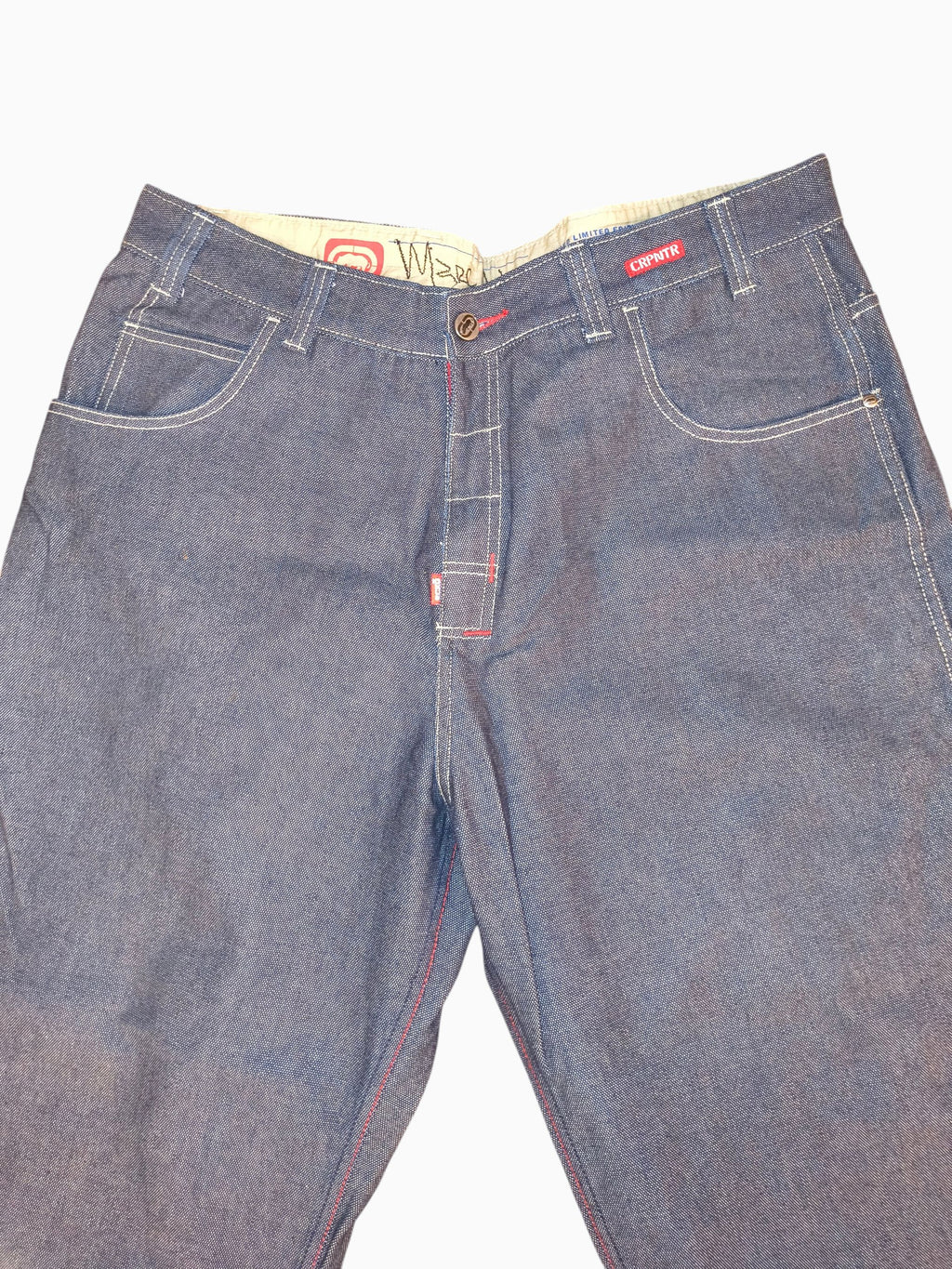 Awsum Thrift vintage Marc Ecko Y2K dark indigo denim carpenter jeans with red contrast stitching and logo details.