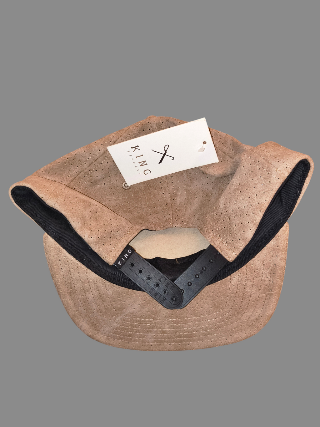 Awsum Thrift King Apparel tan perforated faux-leather snapback hat with black snap closure and brand tag