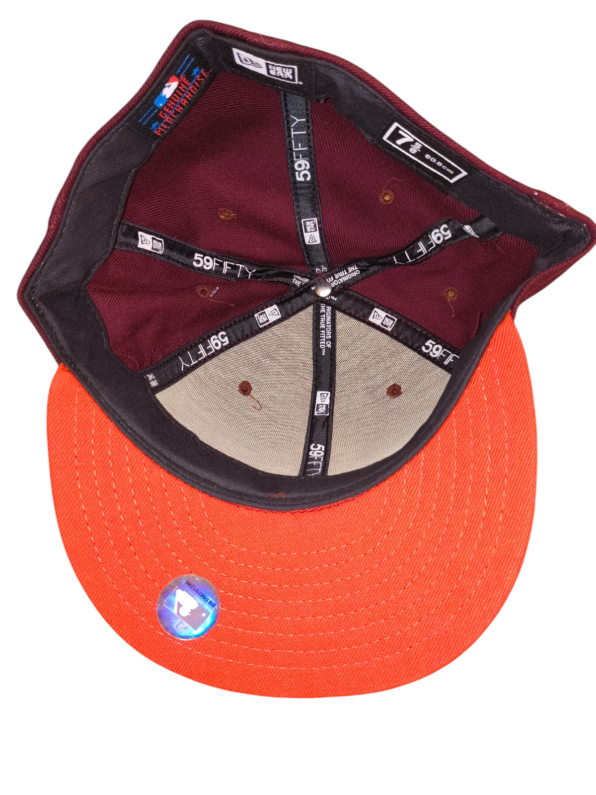 Awsum Thrift New Era 59FIFTY fitted hat showing interior maroon crown and orange brim with MLB merchandise sticker