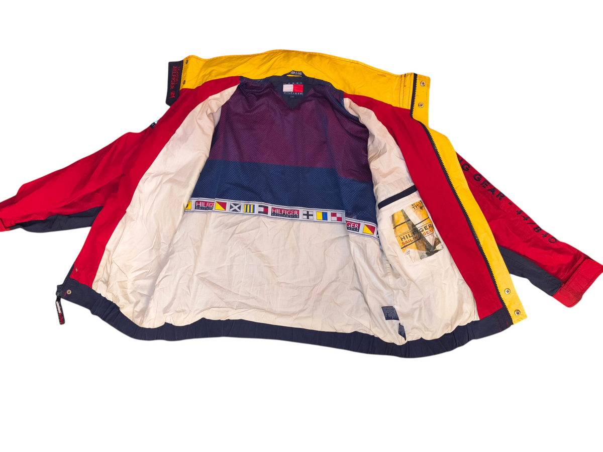 Awsum Thrift vintage Tommy Hilfiger jacket with red, yellow, and blue panels and interior nautical flag detailing