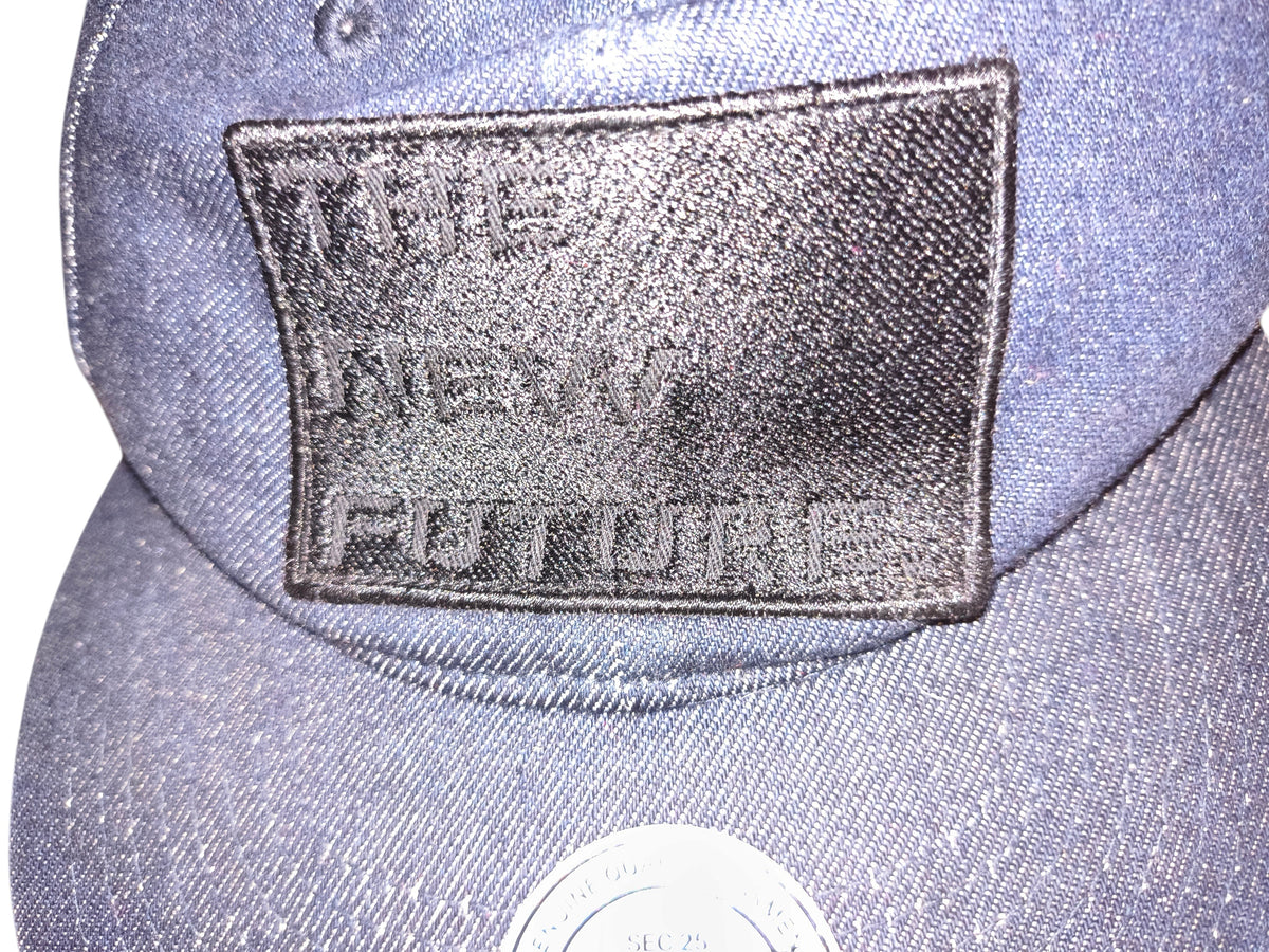 Awsum Thrift H&M blue denim snapback hat with black embroidered The New Future patch on the front crown