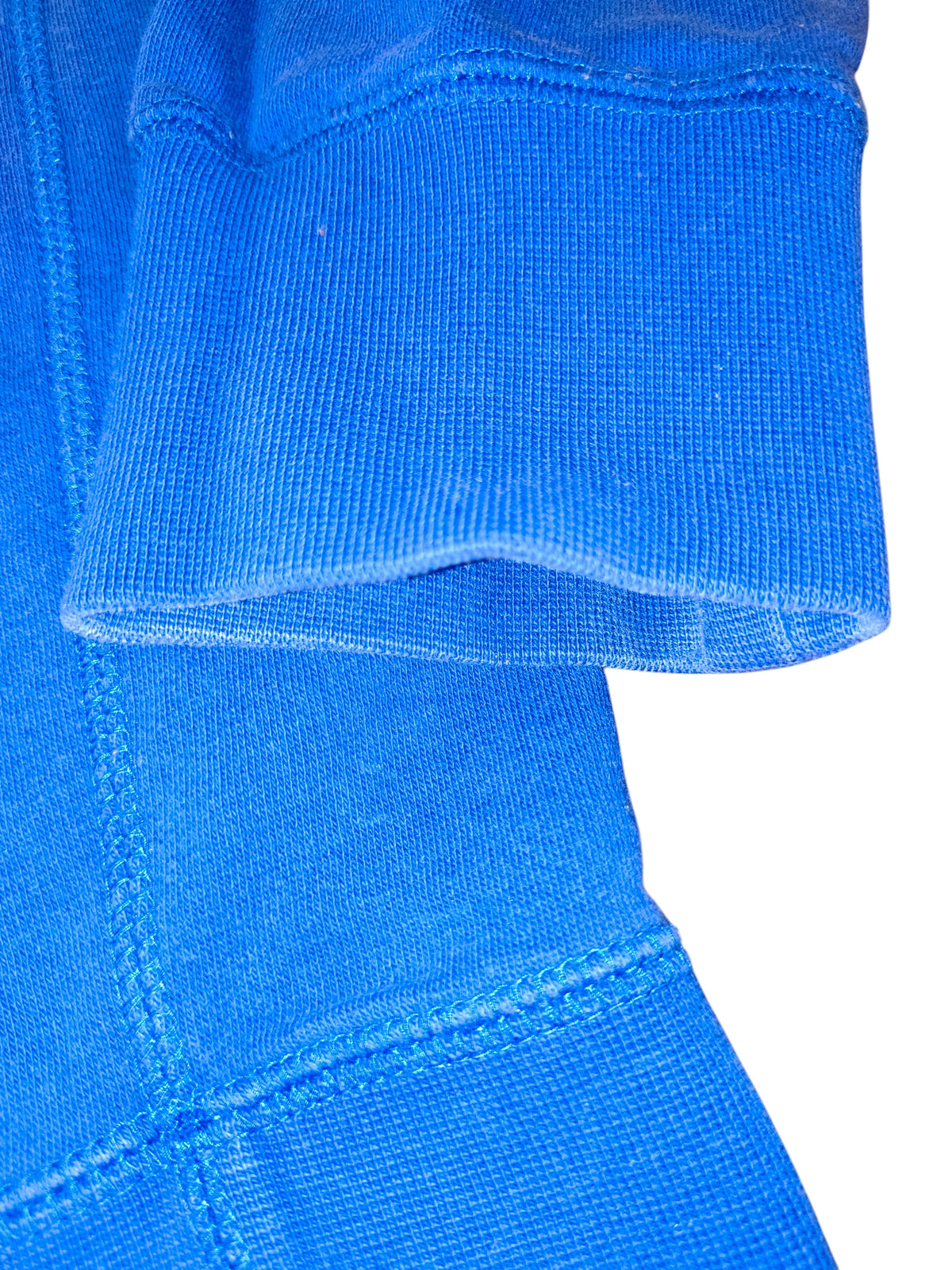 Awsum Thrift Jordan shirt featuring a vibrant blue ribbed cuff and detailed stitching on soft cotton fabric
