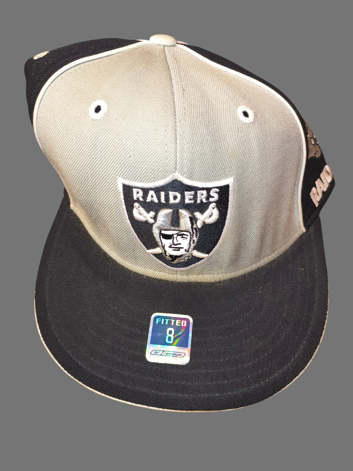 Awsum Thrift vintage Reebok Raiders wool fitted hat with front team logo and size 8 holographic visor sticker