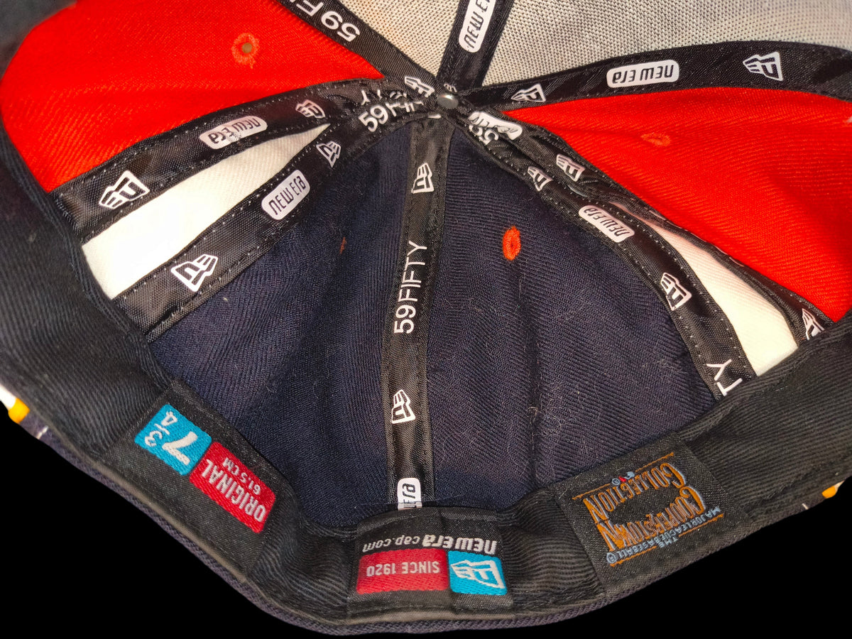 Interior of an Awsum Thrift vintage New Era 59FIFTY Houston Astros fitted hat showing branded taping and labels.