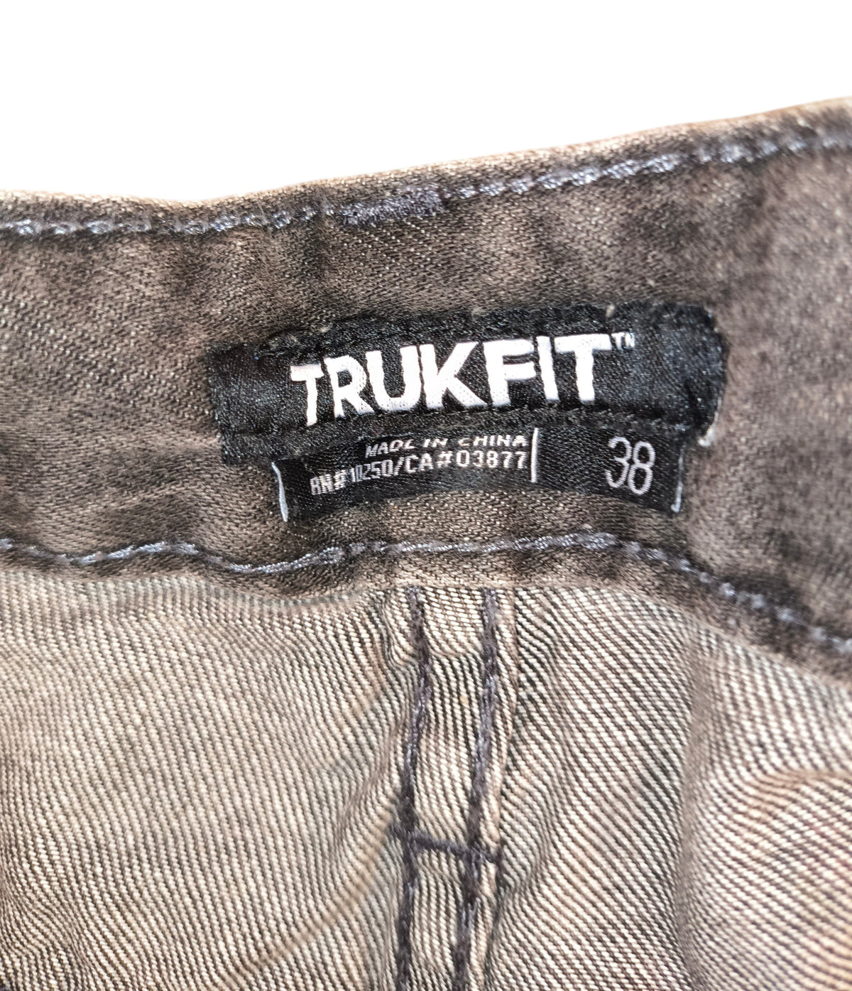 Awsum Thrift TRUKFIT grey denim shorts size 38 interior brand label and stitching detail