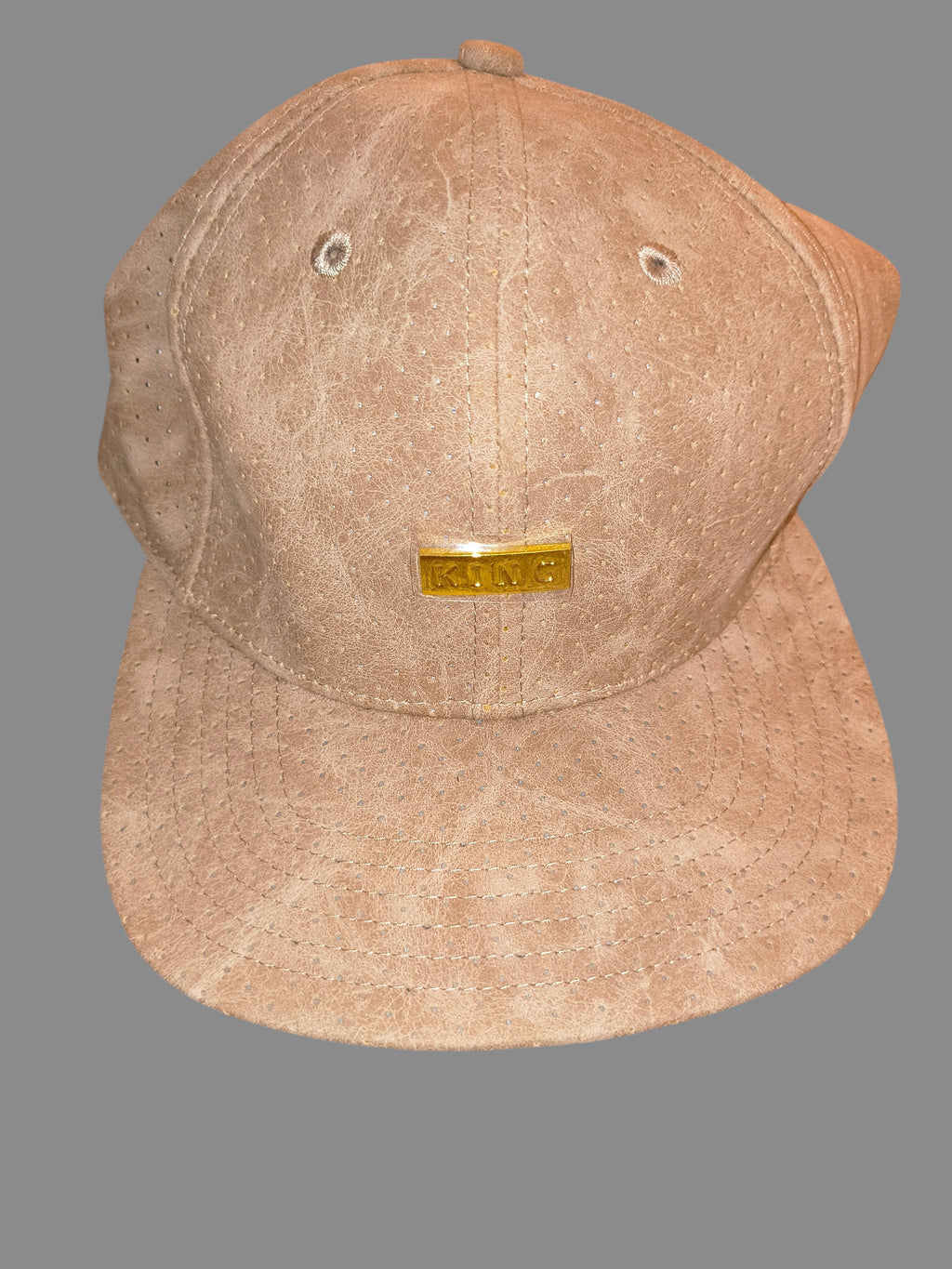 Awsum Thrift King Apparel tan perforated faux-leather snapback hat with a polished gold metal logo plate