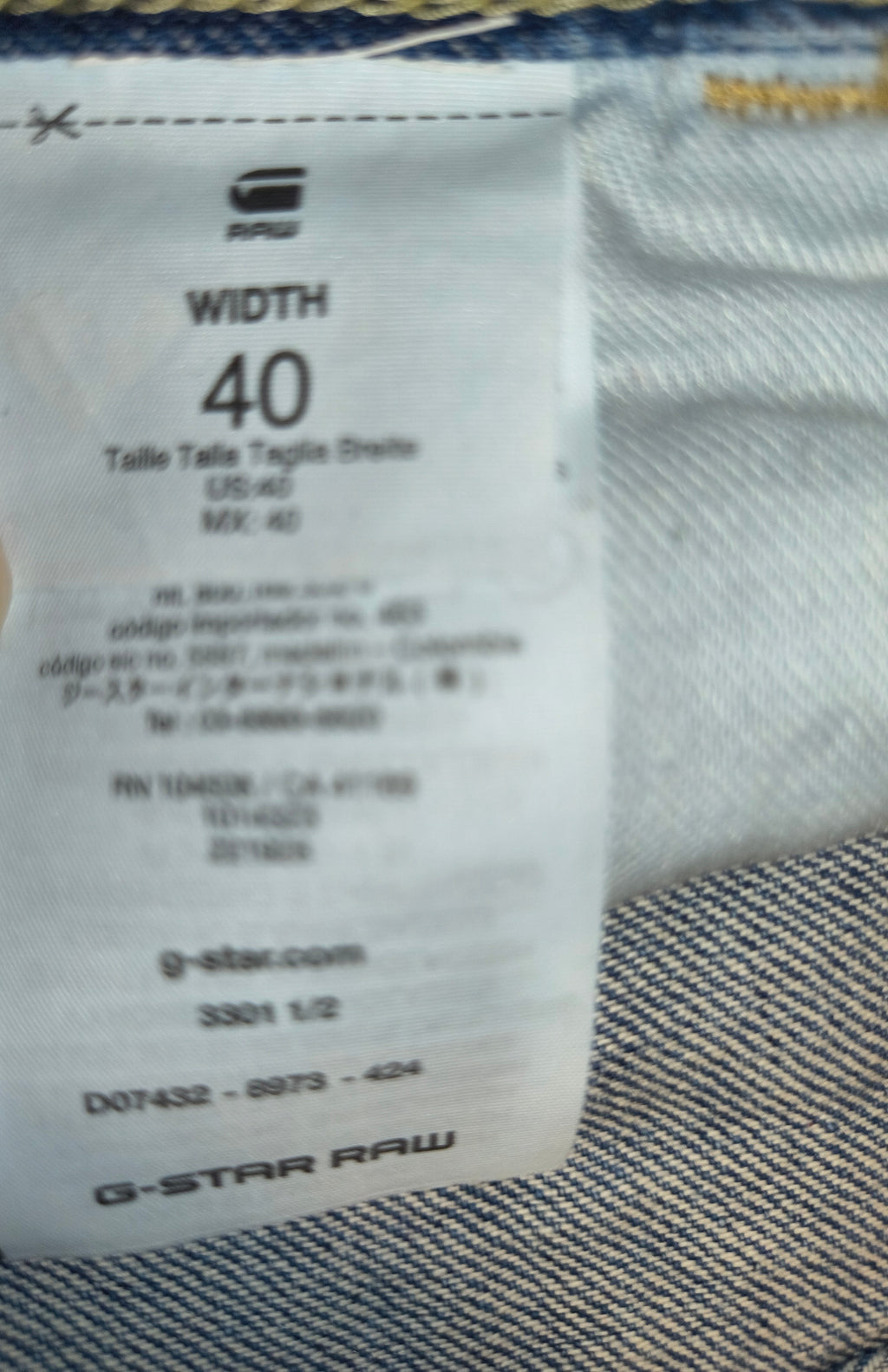 Awsum Thrift G-Raw jean shorts size 40 label detail showing G-Star Raw branding and product information
