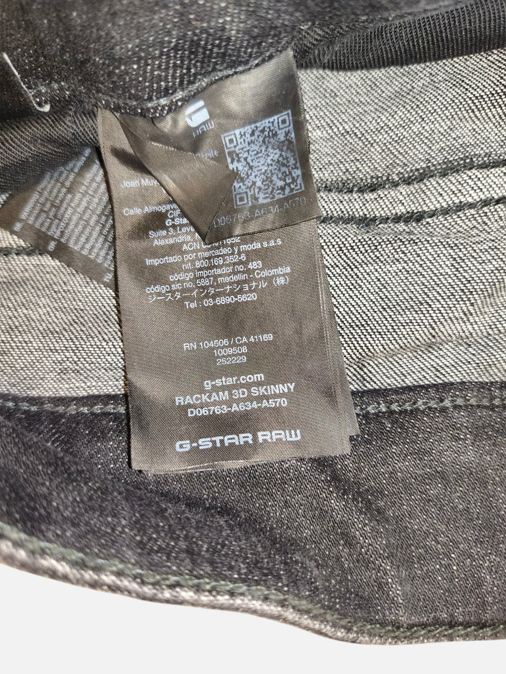 Awsum Thrift G-Raw RackHam jeans interior care label with G-Star Raw branding and product details on black denim