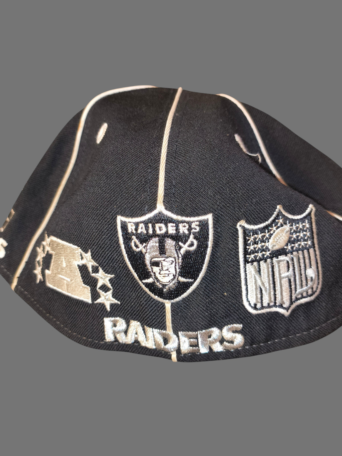 Awsum Thrift vintage Reebok Raiders wool fitted hat with embroidered team logos and NFL shield in black and white