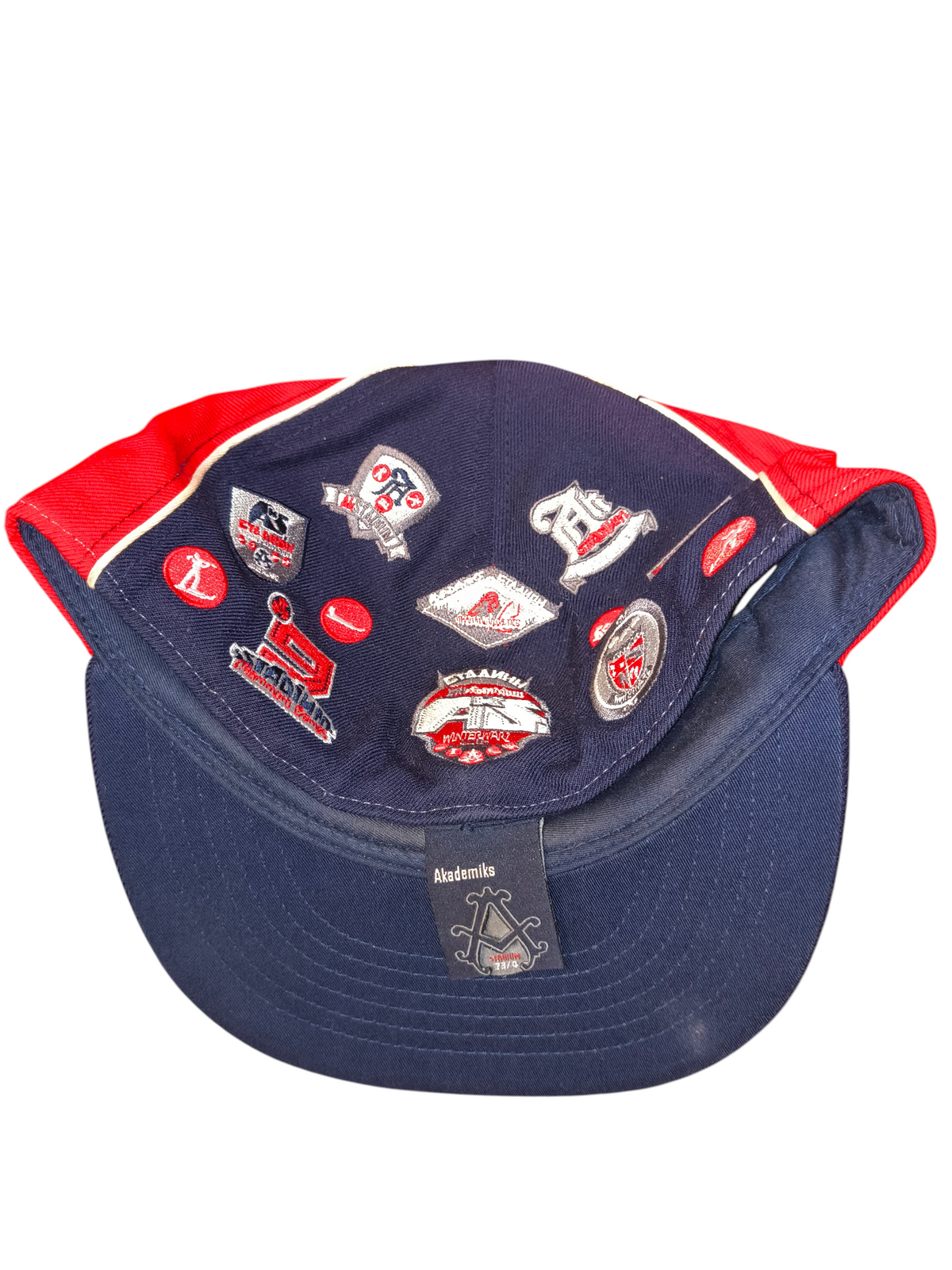 Awsum Thrift vintage Akademiks Stadium Games Winterwarz fitted hat with navy and red panels and embroidered patches.