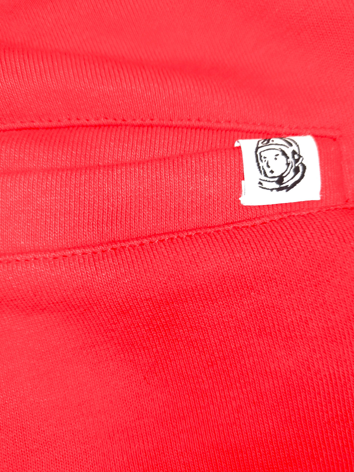 Awsum Thrift Billionaire Boys Club red cotton shorts featuring the iconic astronaut logo patch on the pocket