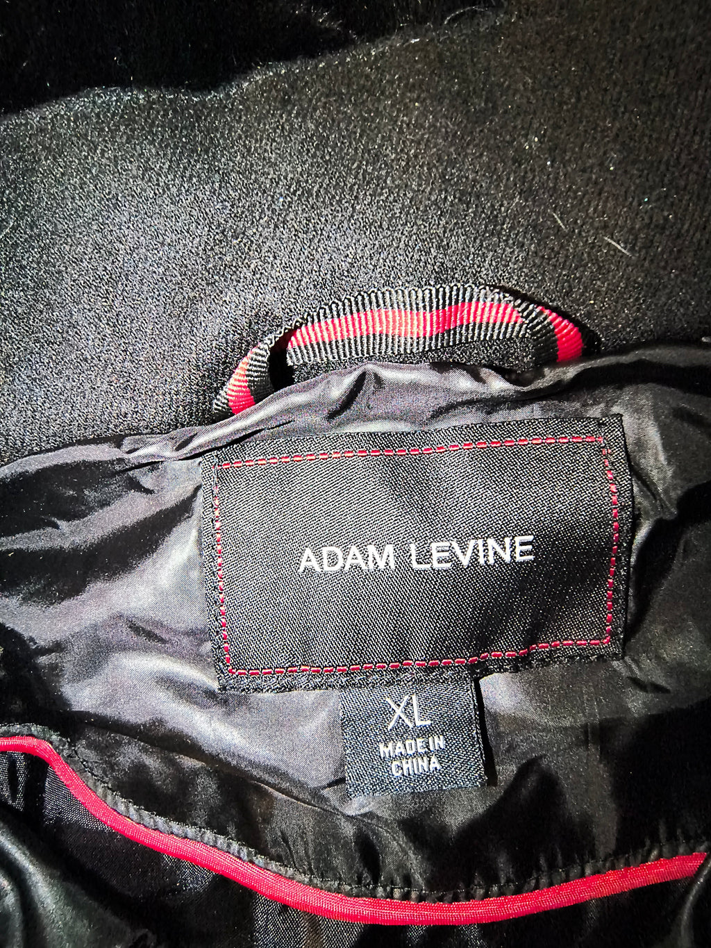 Awsum Thrift Adam Levine black insulated jacket label with red stitching and size XL tag