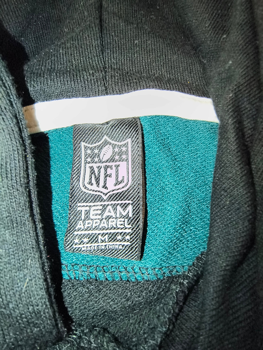 Awsum Thrift NFL Team Apparel Philadelphia Eagles hoodie interior neck label showing size medium