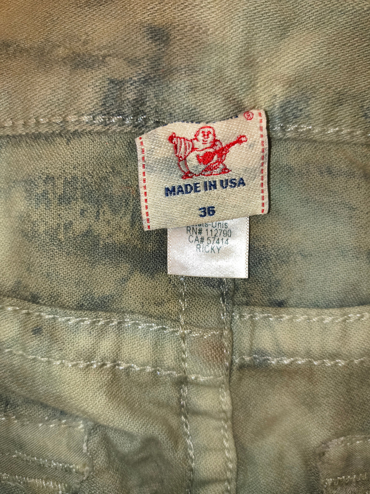 Awsum Thrift True Religion camo pants size 36 tag with Made in USA branding and Buddha logo