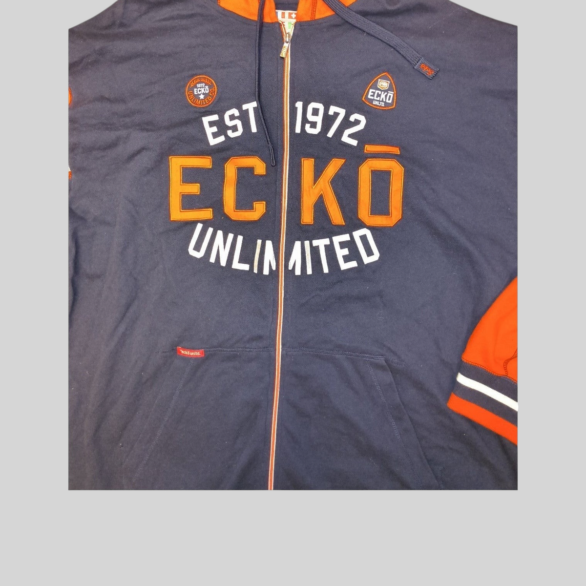 Awsum Thrift Ecko Unltd navy blue and orange full-zip hoodie with EST 1972 graphic and embroidered logo patches