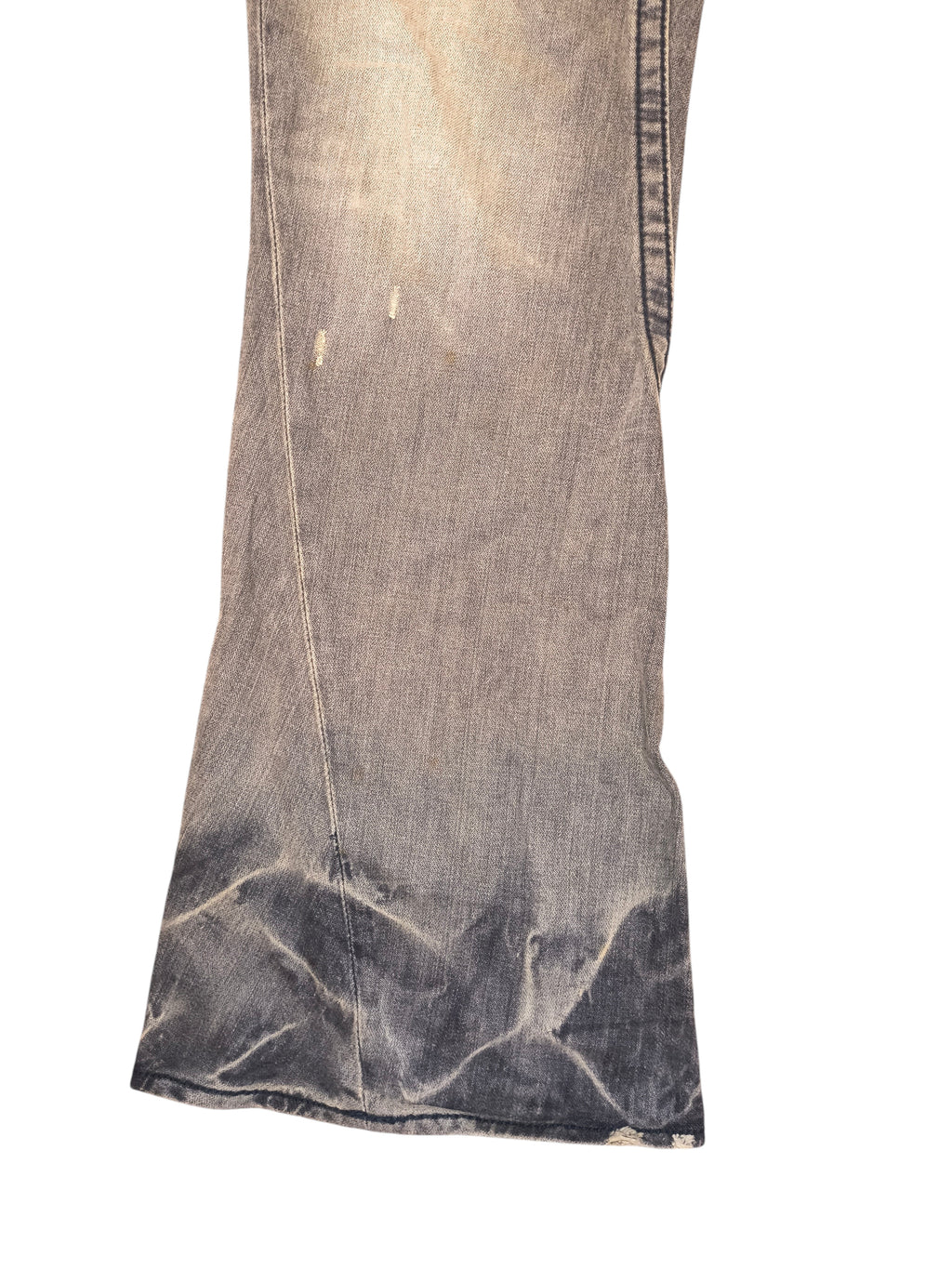 Awsum Thrift vintage True Religion bell bottom jeans in a faded grey wash with distressed denim details.