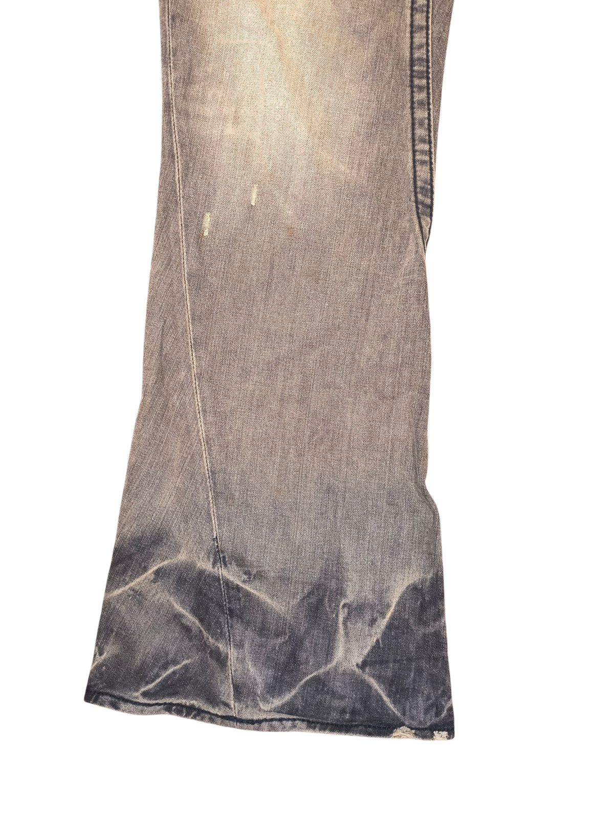 Awsum Thrift vintage True Religion bell bottom jeans in a faded grey wash with distressed denim details.
