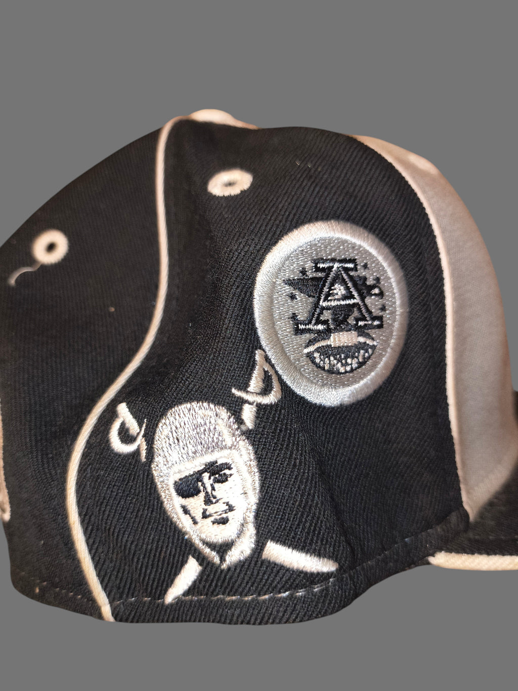 Awsum Thrift vintage Reebok Raiders wool fitted hat featuring embroidered team logos and throwback shield graphics.
