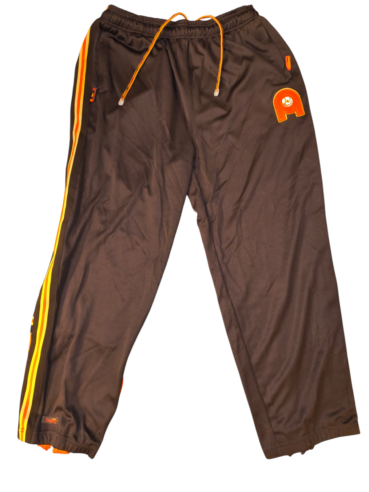 Awsum Thrift vintage Akademiks chocolate brown track pants with orange and yellow side stripes and logo patch