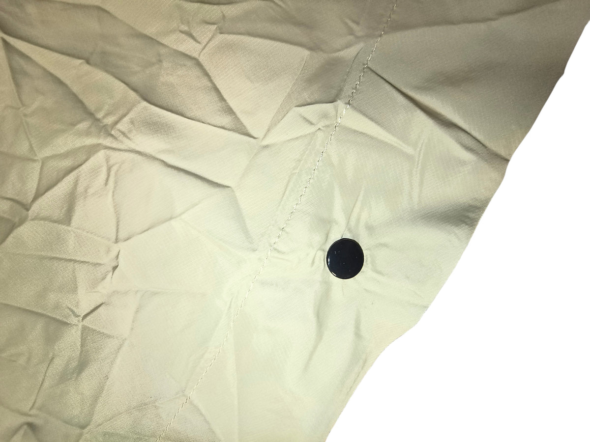 Awsum Thrift All Good khaki tan waterproof rain poncho fabric detail with black snap button closure