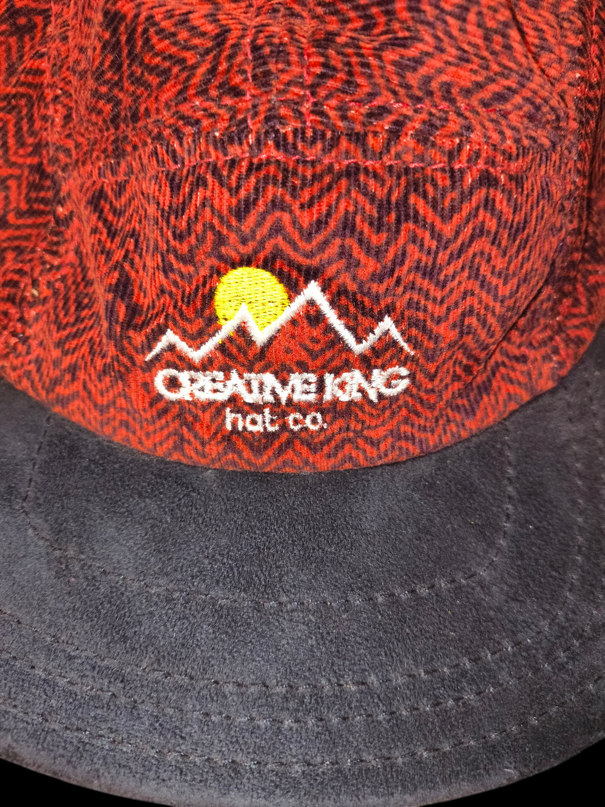 Awsum Thrift Creative King Hat Co. 5-panel camper hat with red and black chevron pattern and black brim